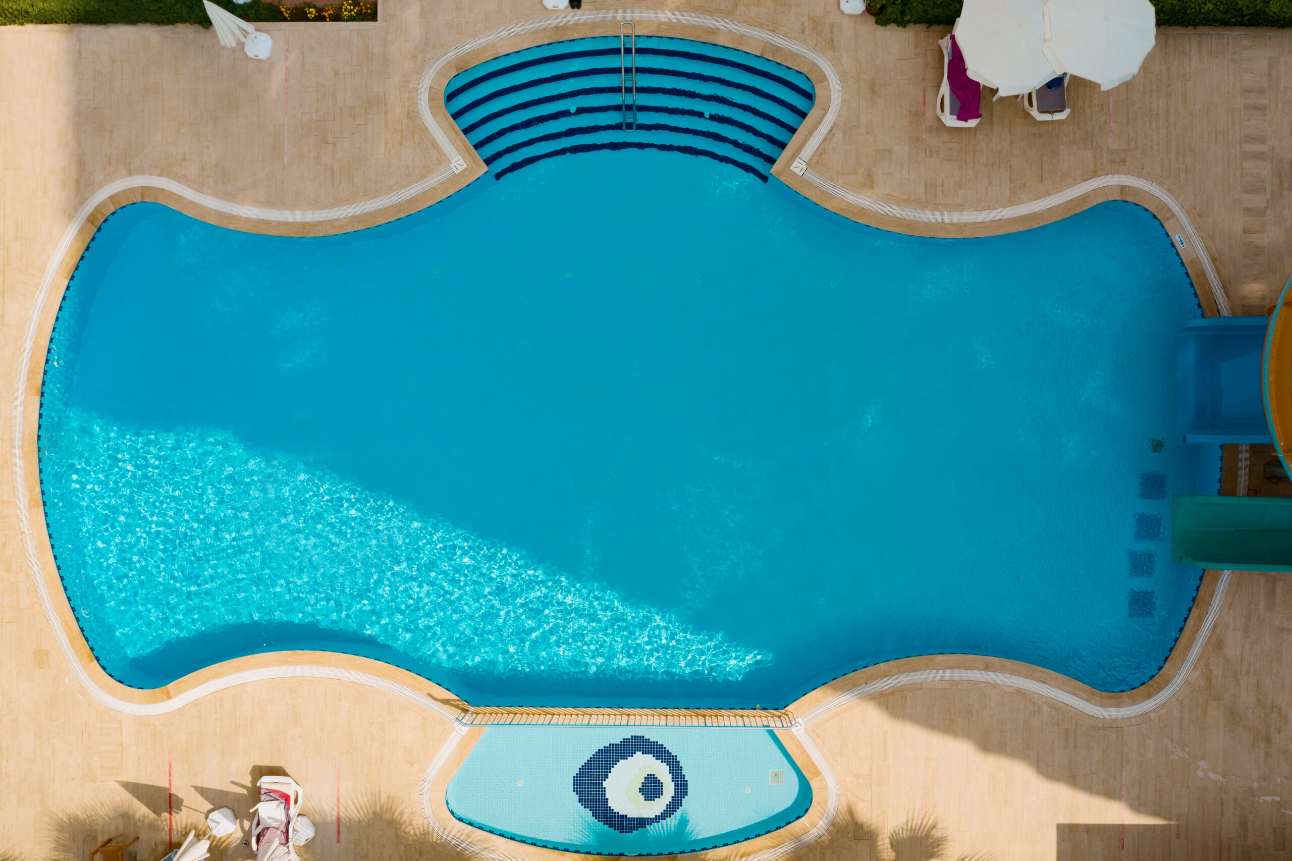 Custom fiberglass swimming pool installed in a New York backyard
